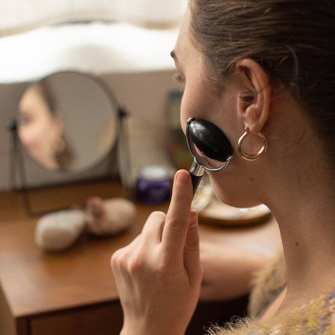 Woman using Face Roller