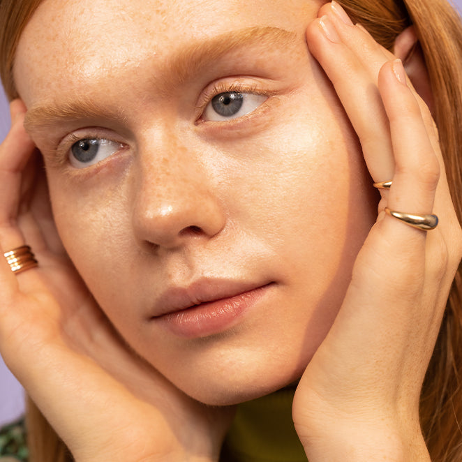 women wearing brightening serum