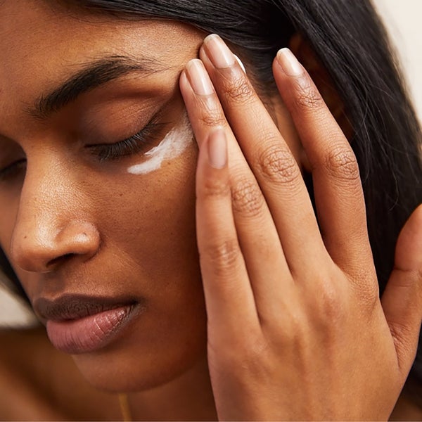 Model Applying Radiant Eye Cream