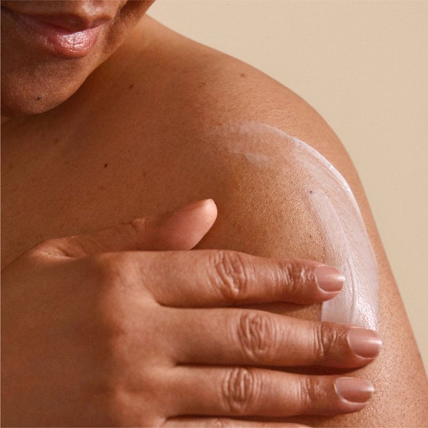 applying body lotion