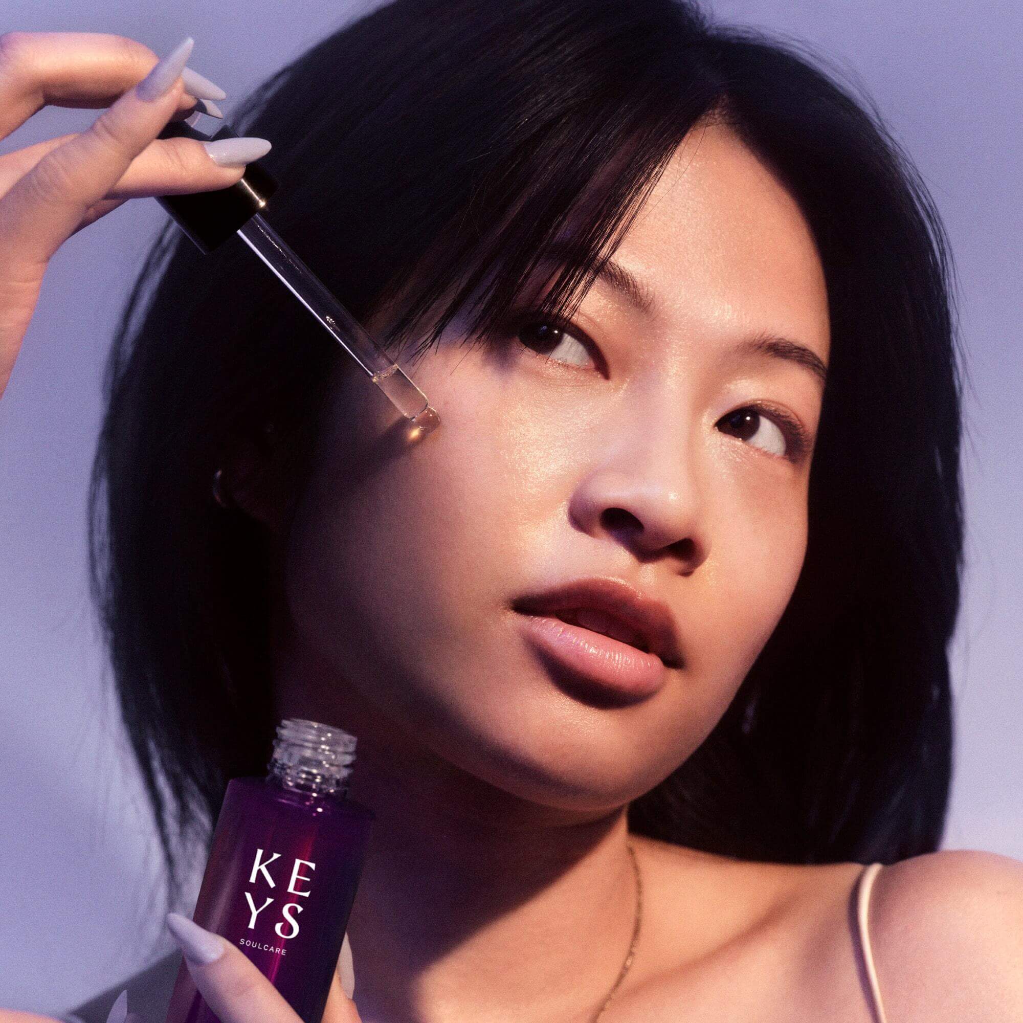 Applying Replenishing Facial Oil on face